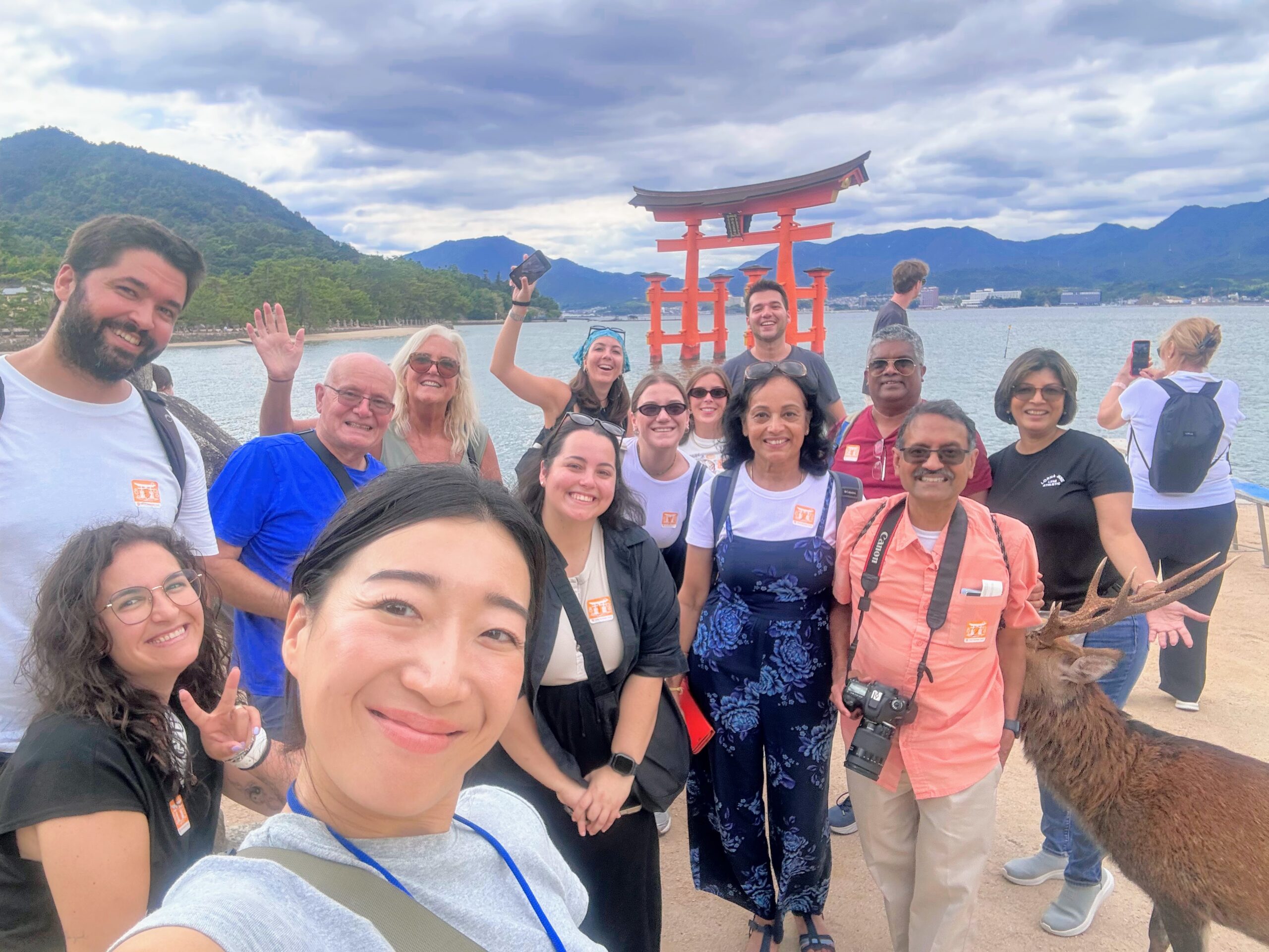 Tour group at the Itsukushima Shrine torii gate on Miyajima Island